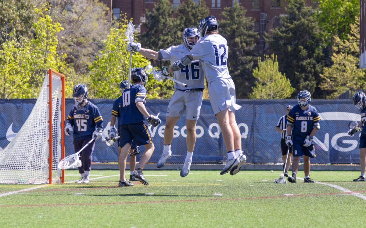 Joe Vranizan (left) and Liam Connor (right) jump for joy.